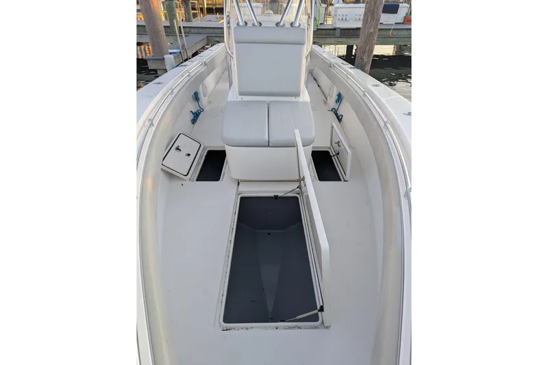  Yacht Photos Pics 2017 Contender 32 ST boat interior with open storage compartments and seating.