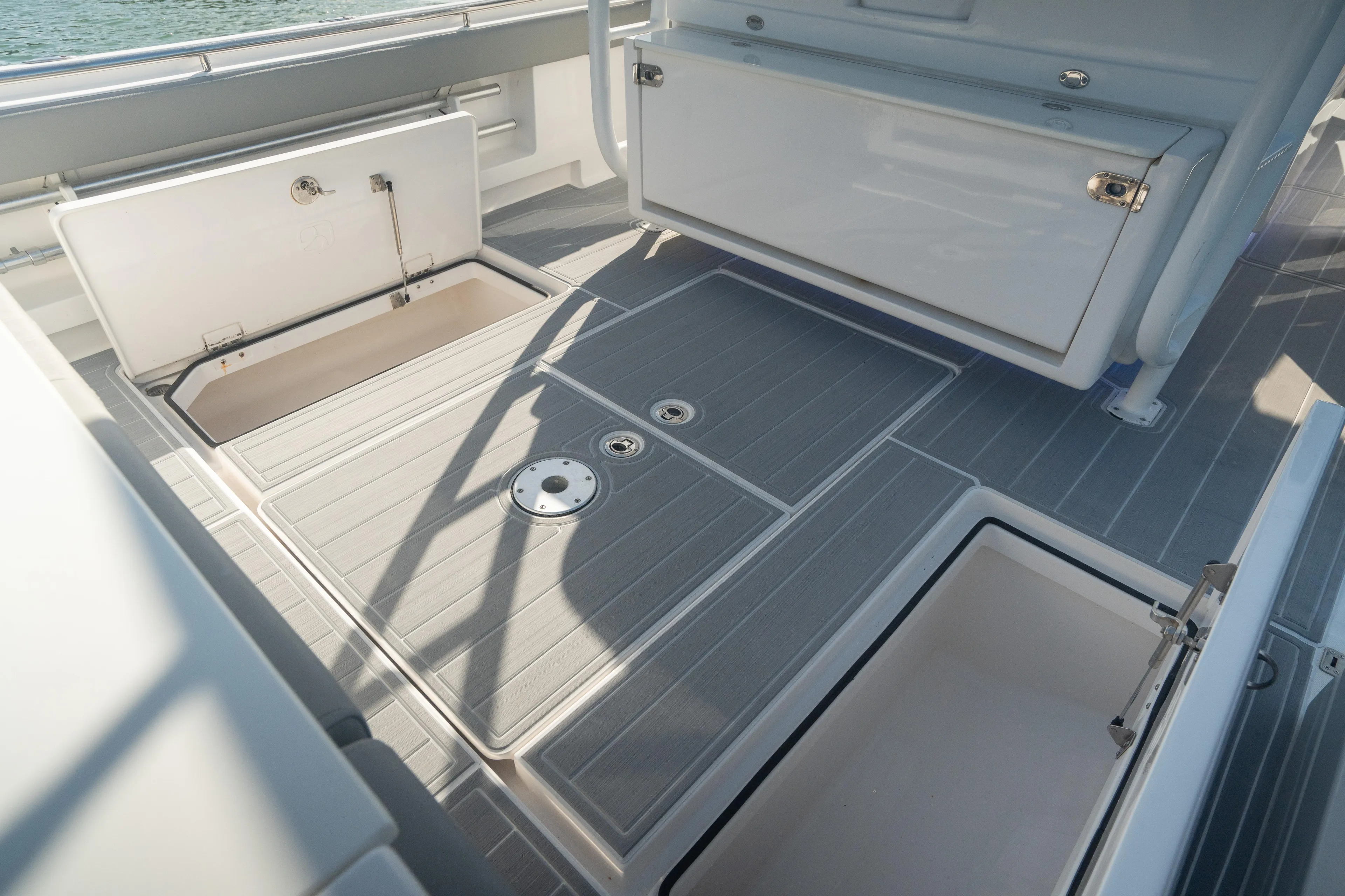  Yacht Photos Pics 2018 Belzona 325 Center Console boat deck with open storage compartments.