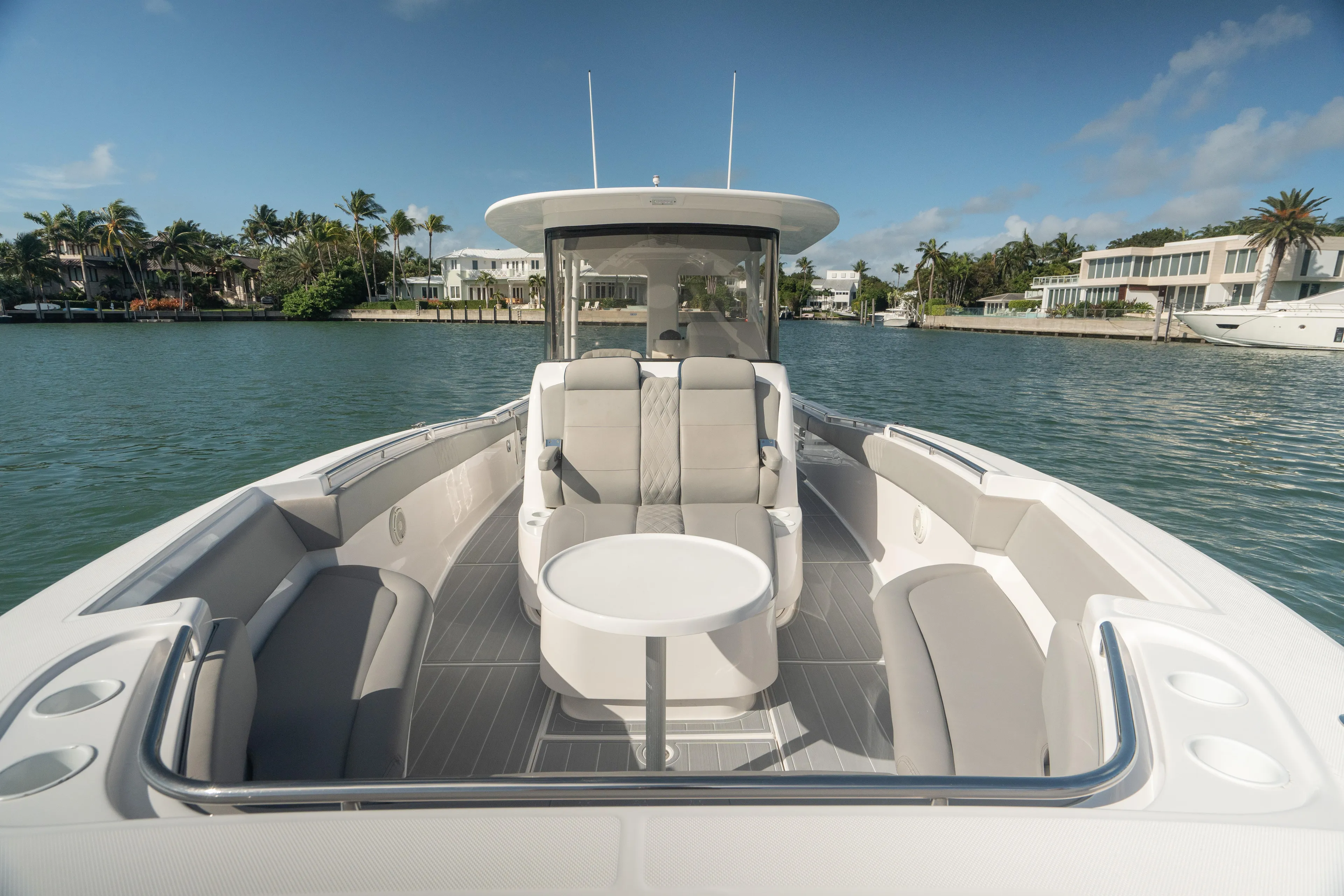  Yacht Photos Pics 2018 Belzona 325 Center Console boat on calm water, featuring spacious seating and modern design.