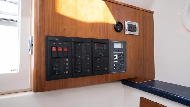  Yacht Photos Pics Control panel of 2018 Belzona 325 Center Console boat, featuring switches and gauges.