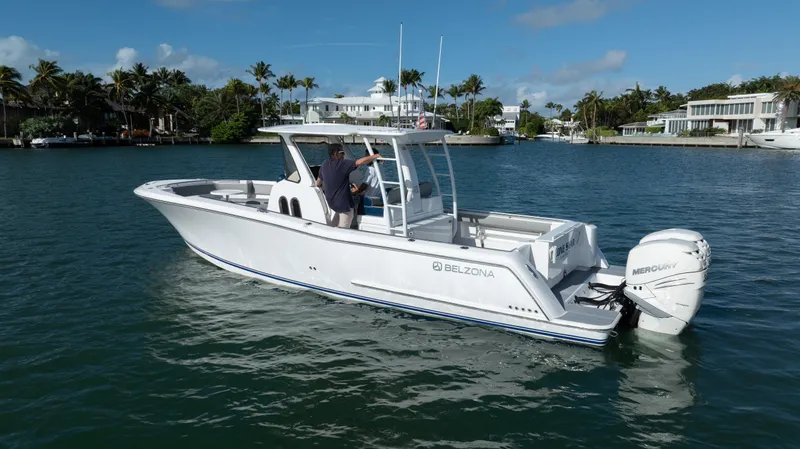  Yacht Photos Pics 2018 Belzona 325 Center Console boat on water, featuring Mercury outboard engines.