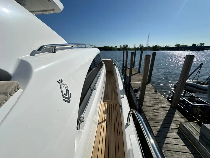 Lucy Penguin Yacht Photos Pics 2019 Van der Valk BeachClub 600 yacht docked by a serene waterfront.