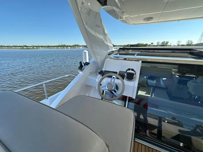 Lucy Penguin Yacht Photos Pics Luxurious 2019 Van der Valk BeachClub 600 yacht helm with scenic water view.