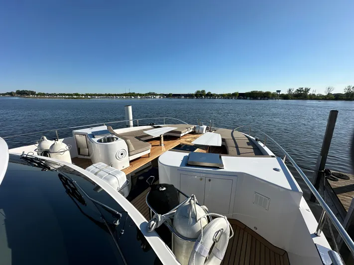 Lucy Penguin Yacht Photos Pics Van der Valk BeachClub 600 yacht deck, 2019 model, on calm water under clear blue sky.