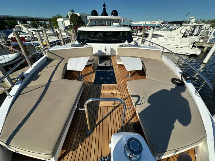 Lucy Penguin Yacht Photos Pics Van der Valk BeachClub 600 yacht deck with seating and tables, docked at marina.