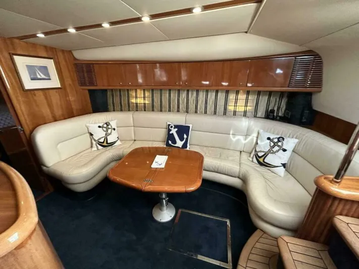  Yacht Photos Pics Luxurious interior of 2003 Sunseeker 50 Camargue yacht with leather seating and nautical decor.