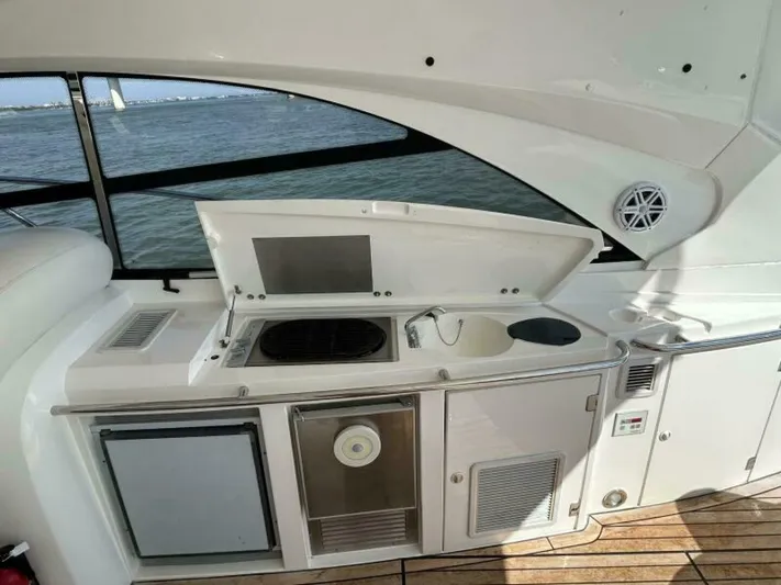  Yacht Photos Pics Outdoor kitchenette on a 2003 Sunseeker 50 Camargue yacht with ocean view.