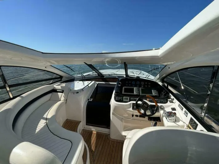  Yacht Photos Pics 2003 Sunseeker 50 Camargue yacht cockpit with modern controls and panoramic view.