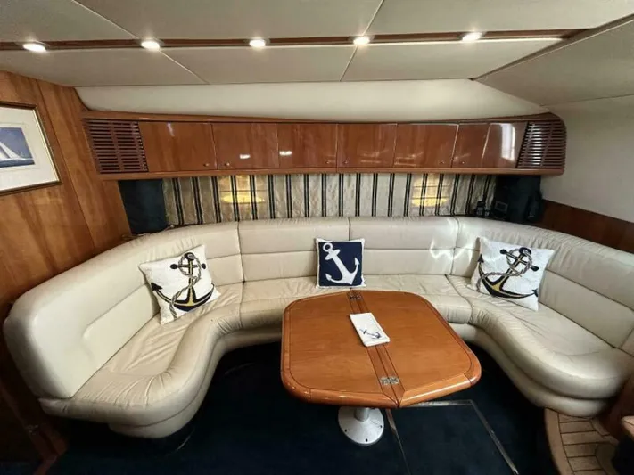  Yacht Photos Pics Luxurious interior of 2003 Sunseeker 50 Camargue yacht with leather seating and nautical decor.