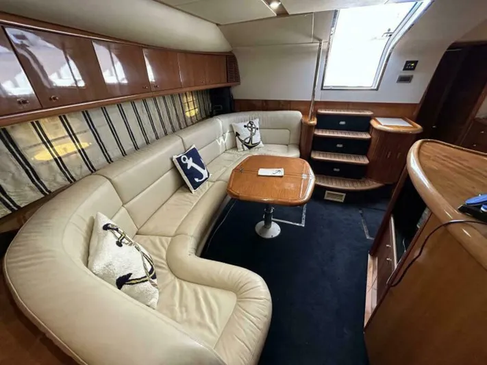  Yacht Photos Pics Luxurious interior of a 2003 Sunseeker 50 Camargue yacht with leather seating and wooden finishes.