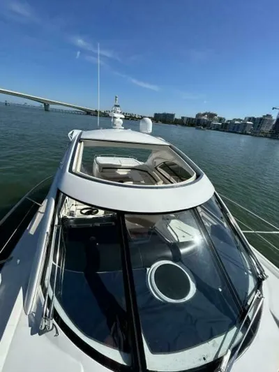  Yacht Photos Pics 2003 Sunseeker 50 Camargue yacht on water with cityscape background.