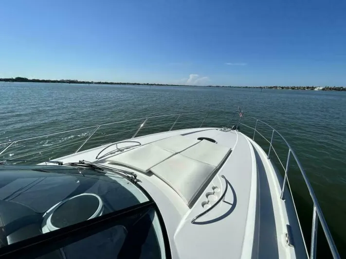  Yacht Photos Pics 2003 Sunseeker 50 Camargue yacht on calm waters under clear blue sky.