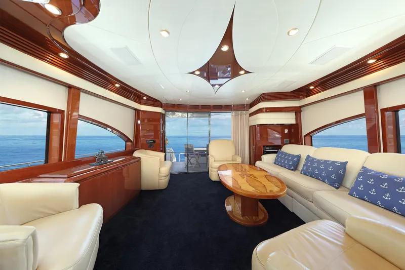 Tuff Ship Yacht Photos Pics Luxurious 2007 Marquis 65 yacht interior with elegant seating and ocean view.