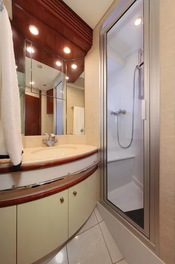 Tuff Ship Yacht Photos Pics Luxurious bathroom in 2007 Marquis 65 yacht with modern shower and elegant vanity.