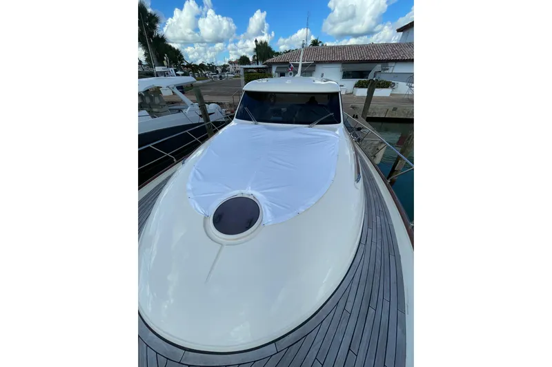  Yacht Photos Pics 2008 Mochi Craft DOLPHIN 44' yacht docked, featuring sleek design and spacious deck.