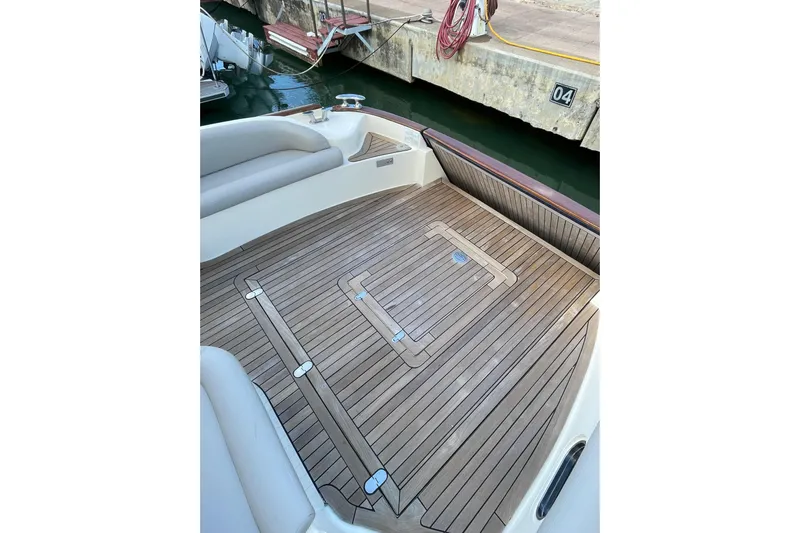  Yacht Photos Pics Teak deck of 2008 Mochi Craft DOLPHIN 44' yacht at dockside.