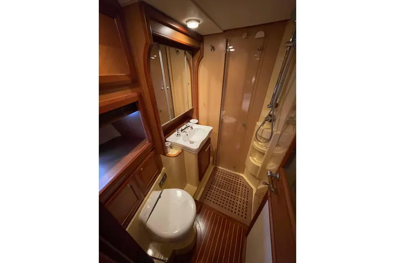  Yacht Photos Pics Luxurious bathroom in 2008 Mochi Craft DOLPHIN 44' yacht with wooden accents.