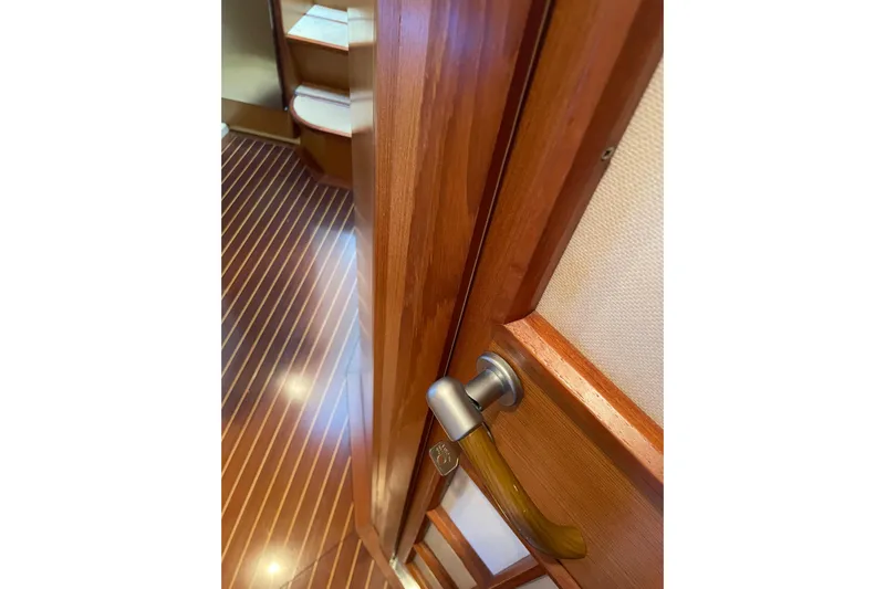  Yacht Photos Pics Interior of 2008 Mochi Craft DOLPHIN 44' yacht with wooden door and handle.