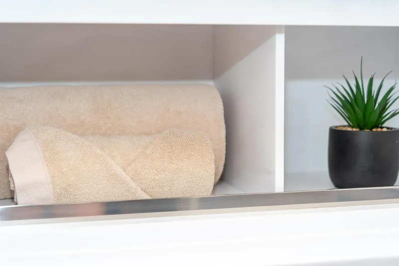 Jewel Yacht Photos Pics Beige towels and potted plant on Fountaine Pajot Alegria 2023 yacht shelf.