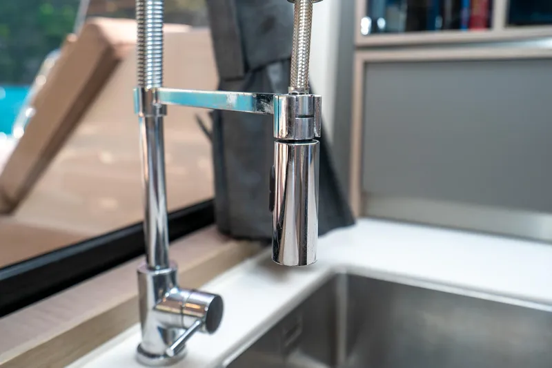 Jewel Yacht Photos Pics Modern kitchen faucet on 2023 Fountaine Pajot Alegria yacht, featuring sleek chrome design.