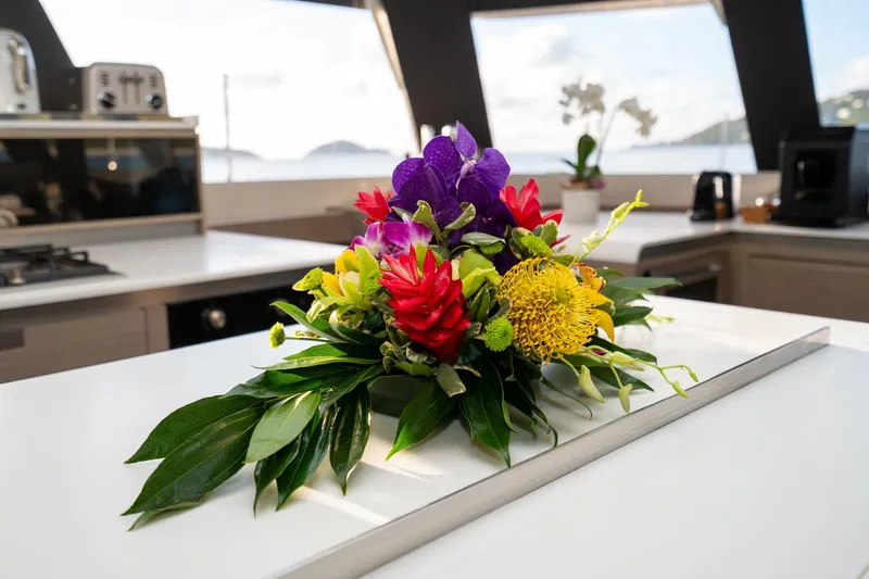 Jewel Yacht Photos Pics Floral arrangement on Fountaine Pajot Alegria 2023 yacht kitchen counter.