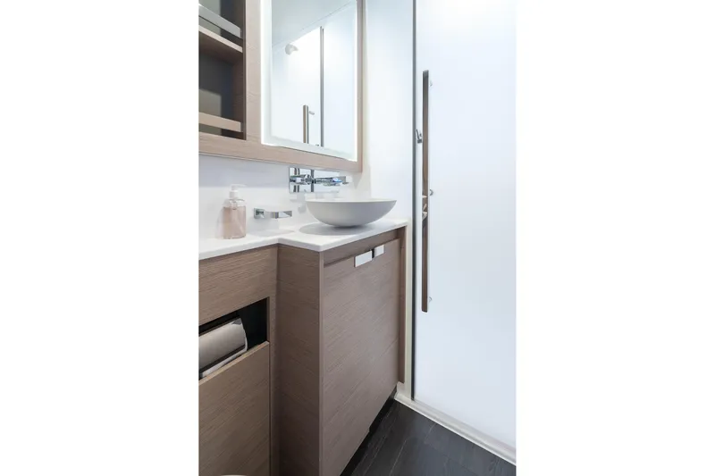 Jewel Yacht Photos Pics Modern bathroom interior on 2023 Fountaine Pajot Alegria yacht, featuring sleek design and vessel sink.