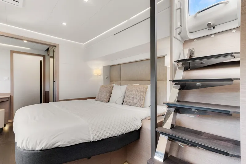 Jewel Yacht Photos Pics Luxurious bedroom interior of 2023 Fountaine Pajot Alegria yacht with modern design.