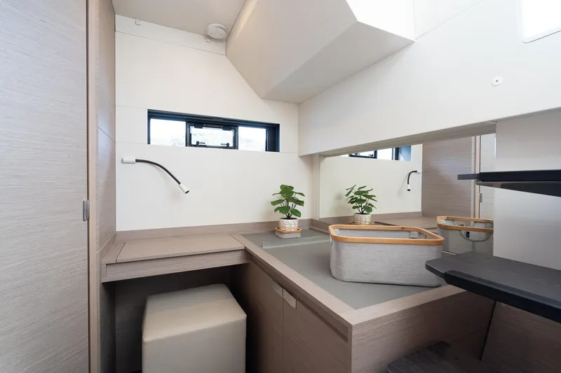 Jewel Yacht Photos Pics Modern bathroom interior of 2023 Fountaine Pajot Alegria yacht with sleek design and plants.