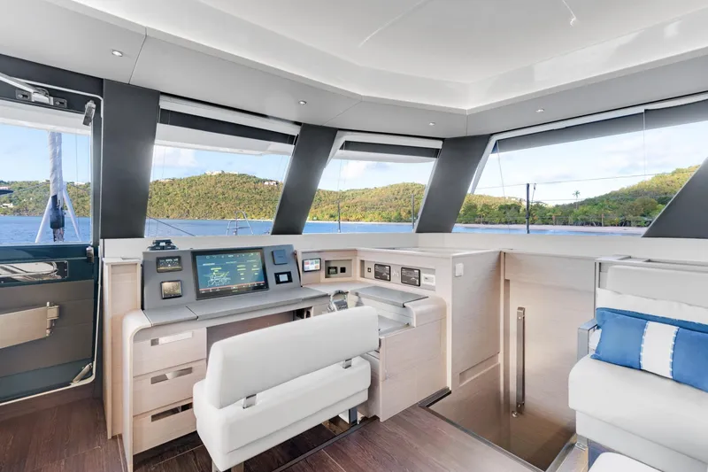 Jewel Yacht Photos Pics Luxurious interior of 2023 Fountaine Pajot Alegria yacht with modern navigation controls.