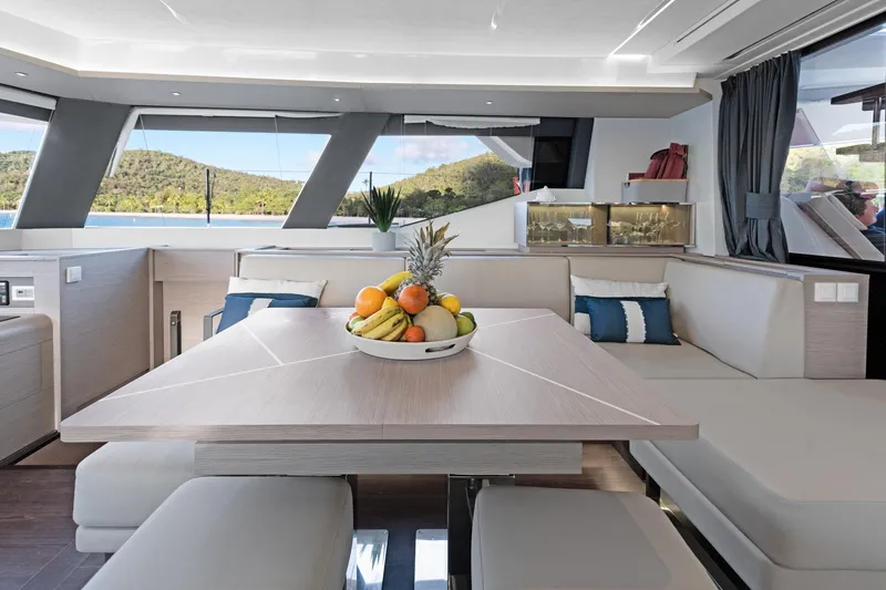 Jewel Yacht Photos Pics Luxurious interior of 2023 Fountaine Pajot Alegria yacht with elegant dining area.