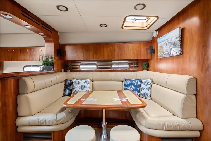 Playpen Yacht Photos Pics Luxurious interior of 2003 Tiara Yachts 5200 Sovran with elegant seating and decor.