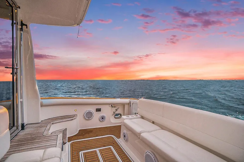 Playpen Yacht Photos Pics 2003 Tiara Yachts 5200 Sovran deck with ocean sunset view.