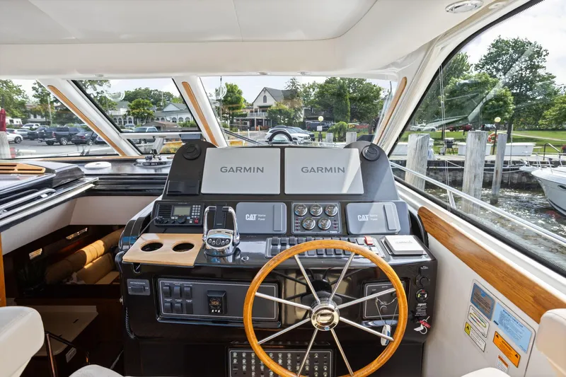 Playpen Yacht Photos Pics Helm of 2003 Tiara Yachts 5200 Sovran with Garmin navigation system.