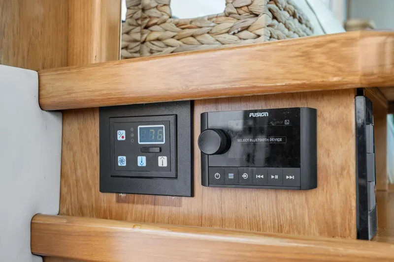 Playpen Yacht Photos Pics Control panel and Bluetooth device on 2003 Tiara Yachts 5200 Sovran interior.