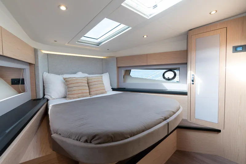  Yacht Photos Pics Luxurious cabin interior of 2022 Monte Carlo 52 yacht with skylight and modern design.