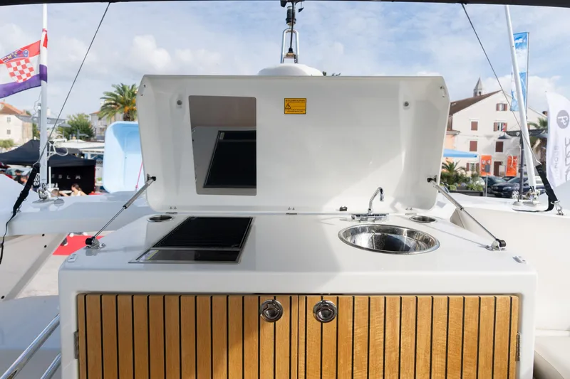  Yacht Photos Pics Outdoor kitchen on 2022 Monte Carlo 52 yacht with sink and grill.