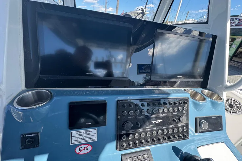  Yacht Photos Pics Control panel of 2026 Tidewater 320 CC Adventure boat with dual Garmin screens.