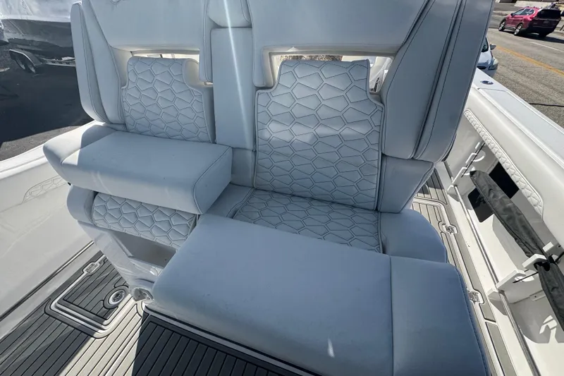  Yacht Photos Pics 2026 Tidewater 320 CC Adventure boat with luxurious white seating and modern design.