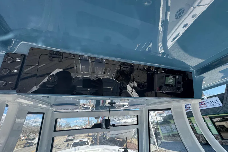  Yacht Photos Pics 2026 Tidewater 320 CC Adventure boat dashboard with navigation controls and display.