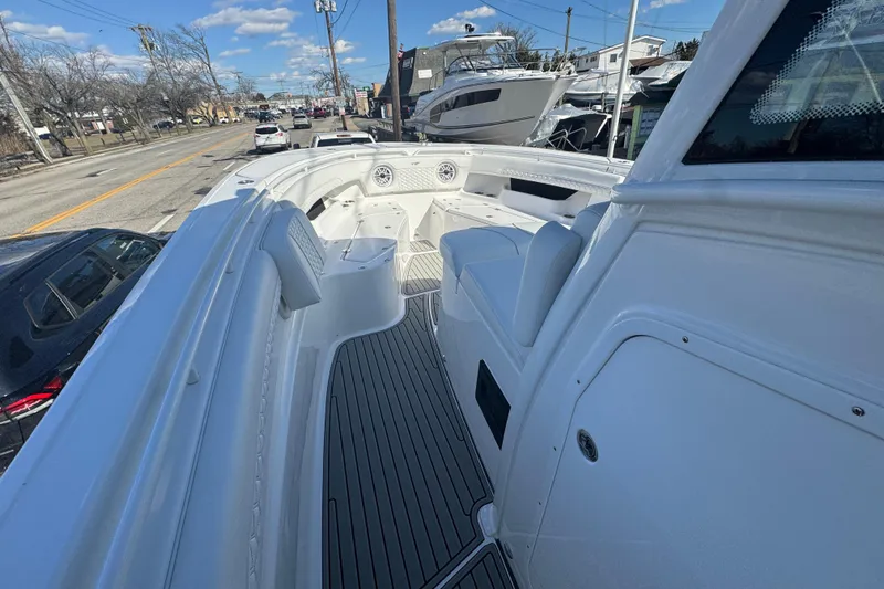  Yacht Photos Pics 2026 Tidewater 320 CC Adventure boat with sleek white interior and modern design.