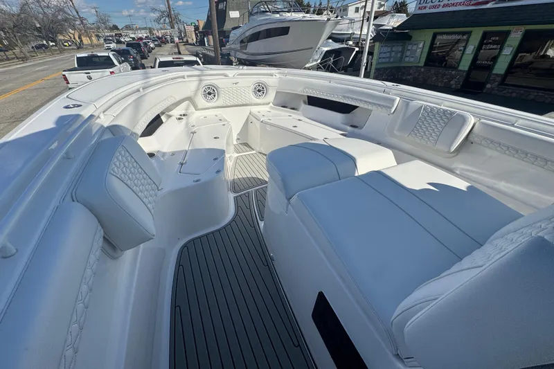  Yacht Photos Pics 2026 Tidewater 320 CC Adventure boat interior with luxurious seating and modern design.