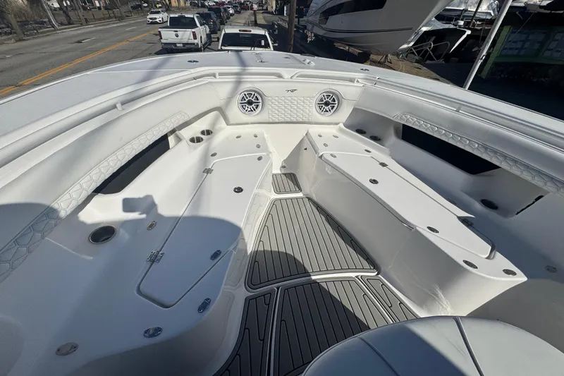  Yacht Photos Pics 2026 Tidewater 320 CC Adventure boat interior with seating and storage compartments.