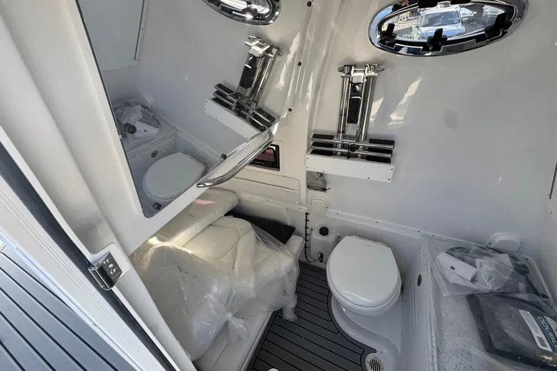  Yacht Photos Pics 2026 Tidewater 320 CC Adventure boat interior with modern bathroom amenities.