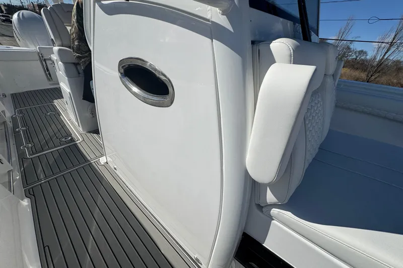 Yacht Photos Pics 2026 Tidewater 320 CC Adventure boat interior with sleek seating and modern design.