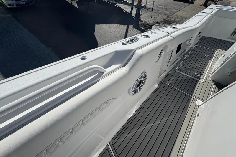  Yacht Photos Pics 2026 Tidewater 320 CC Adventure boat deck with sleek design and modern features.