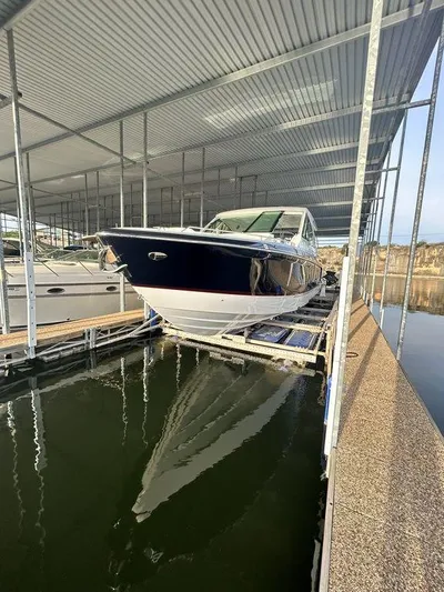  Yacht Photos Pics 2021 Formula 380 Super Sport Crossover docked in a covered marina.
