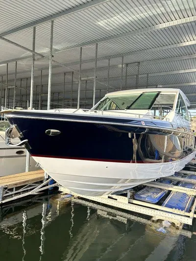  Yacht Photos Pics 2021 Formula 380 Super Sport Crossover boat docked in covered marina.