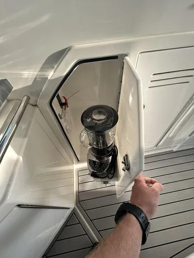  Yacht Photos Pics 2021 Formula 380 Super Sport Crossover with built-in storage compartment and blender.
