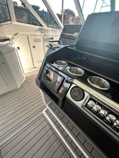  Yacht Photos Pics 2021 Formula 380 Super Sport Crossover boat interior with sleek kitchen amenities.