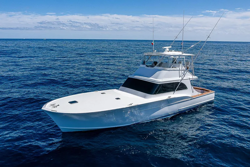 Will Rise Yacht Photos Pics Custom Carolina 58 yacht, 2005 model, cruising on open ocean.